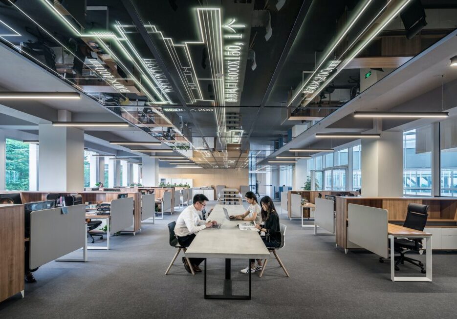 Modern open-plan office with people working.