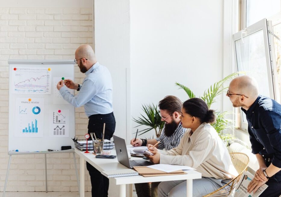 Team meeting with charts and graphs.