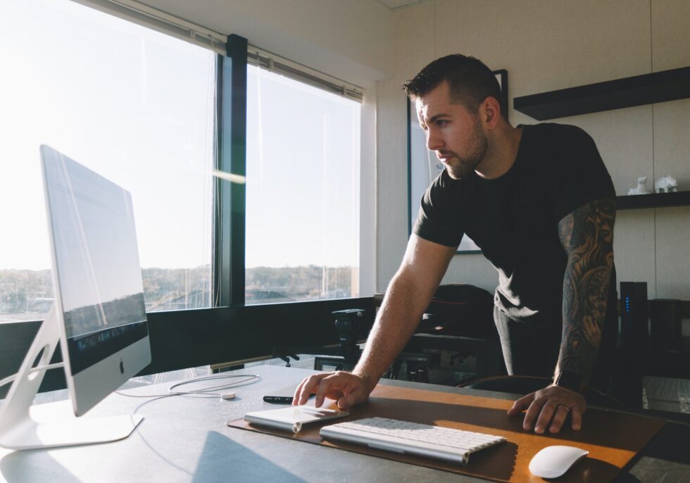 Man working at a computer desk.